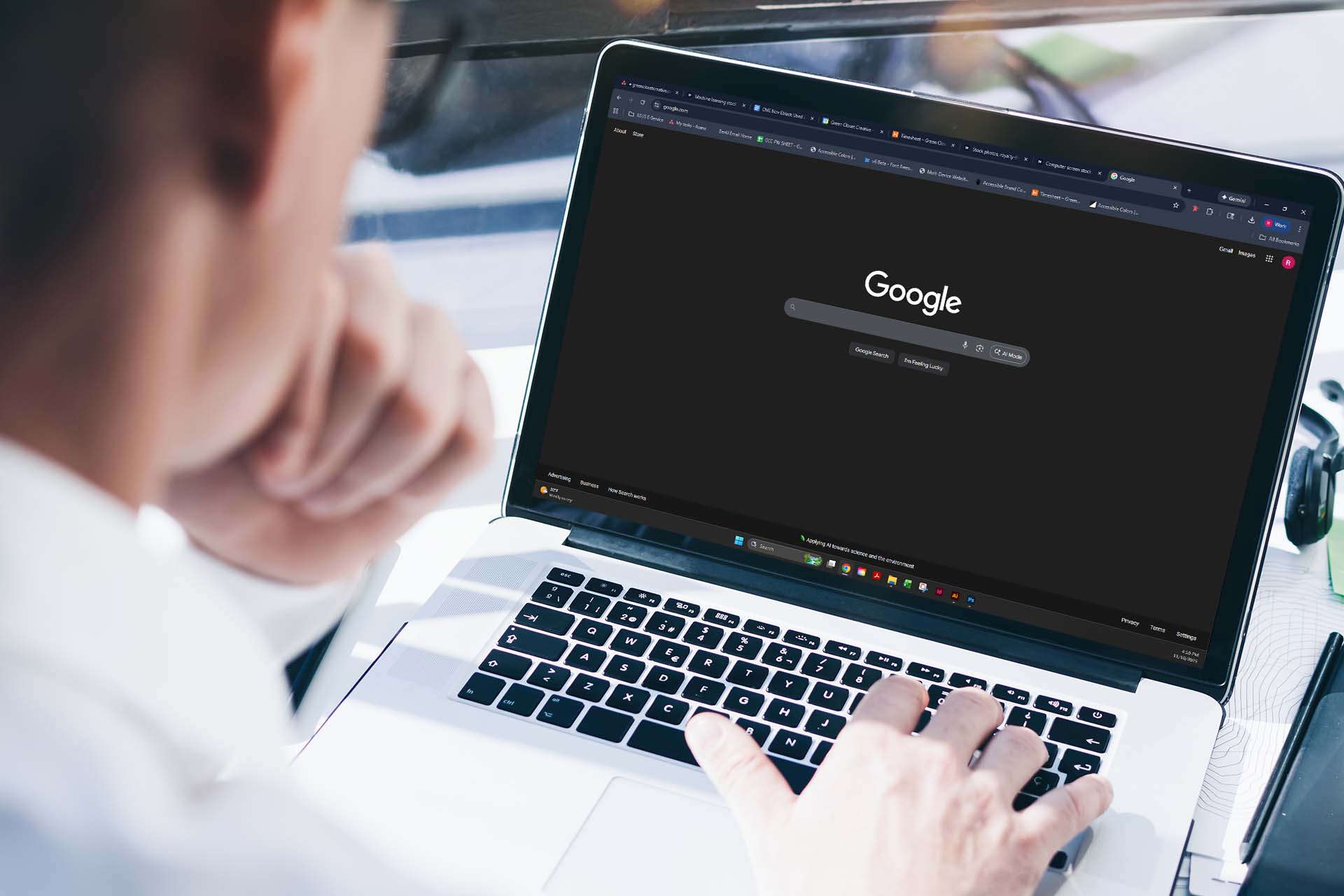 man looking at google search homepage