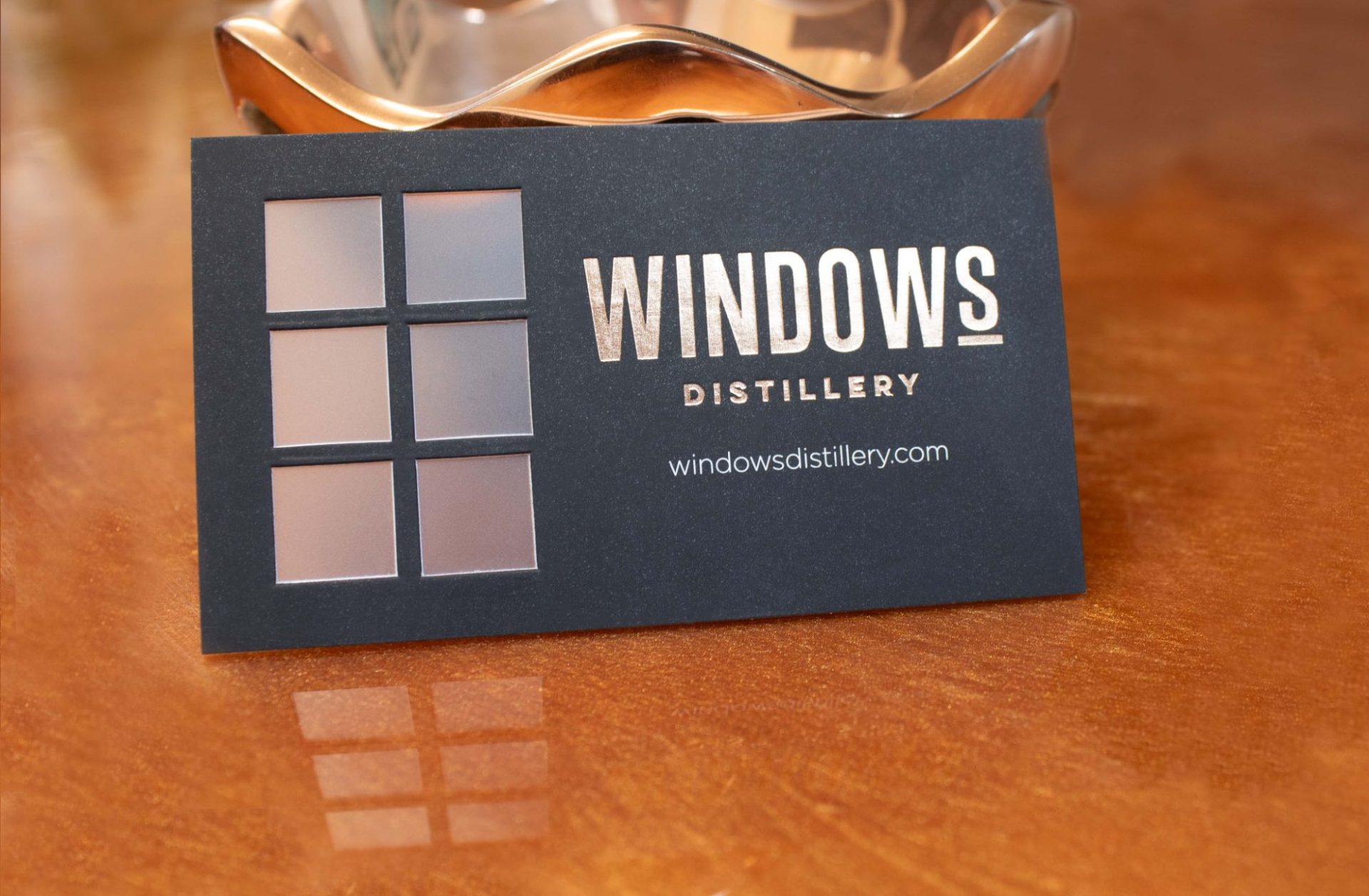 Windows Distillery business cards with vellum panes so light and objects can show through