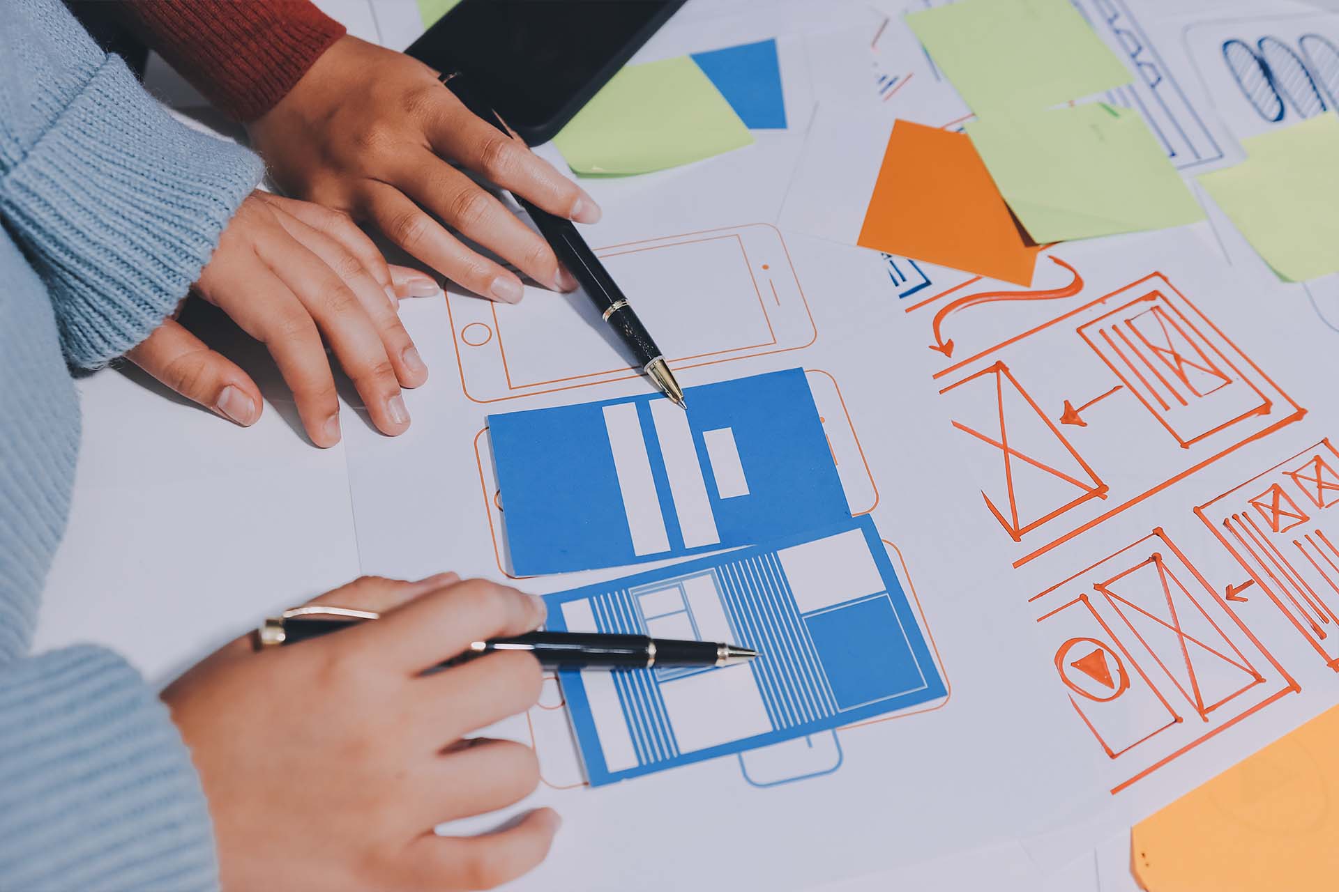 two people designing website layout