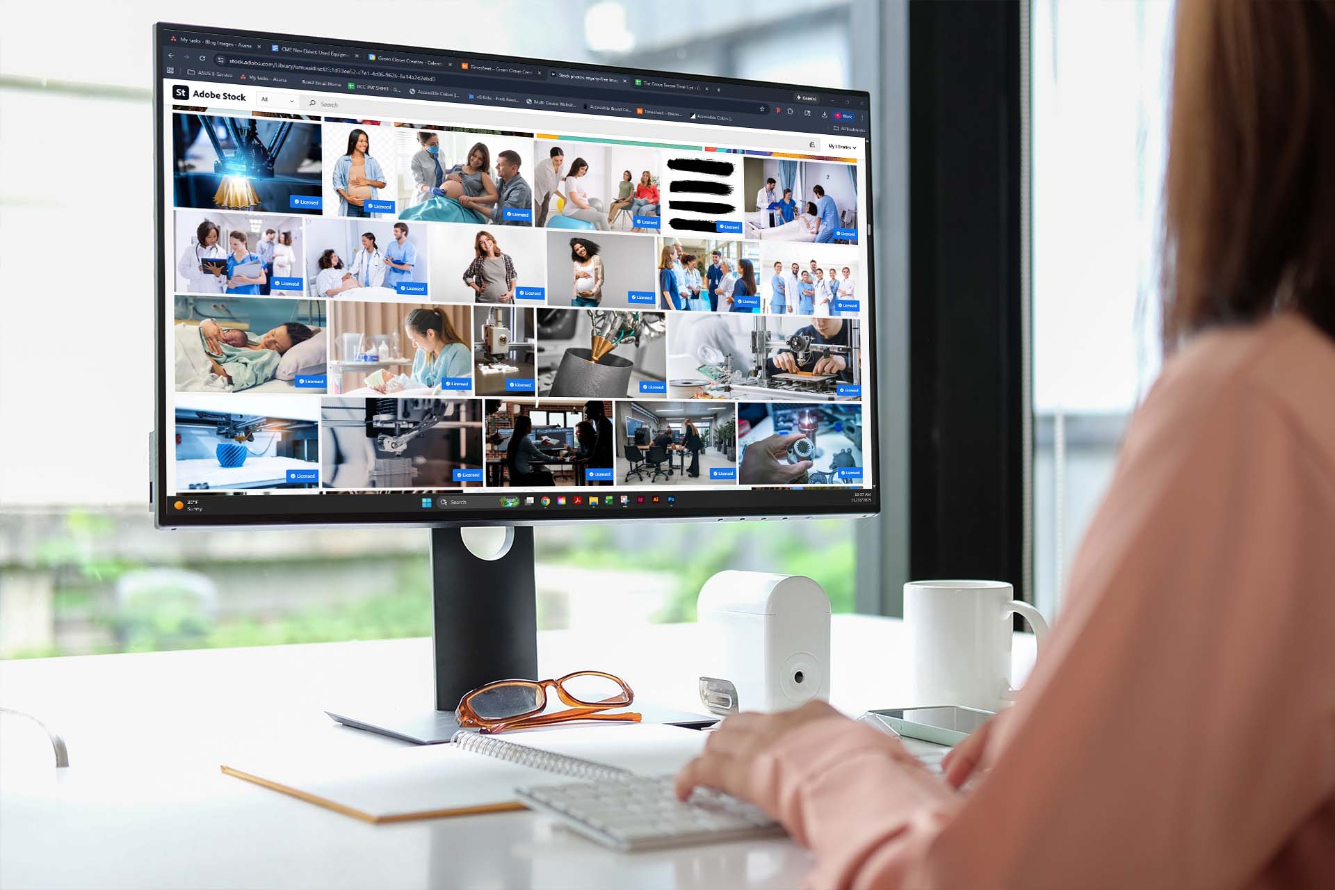 woman searching up photos on adobe stock