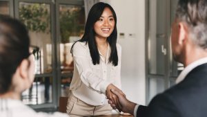 interviewee shaking hands with the employer