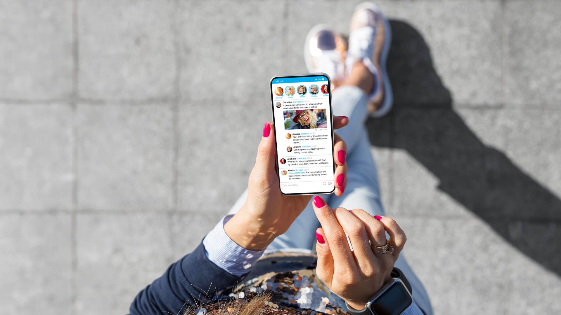 a woman holding a phone looking at social media